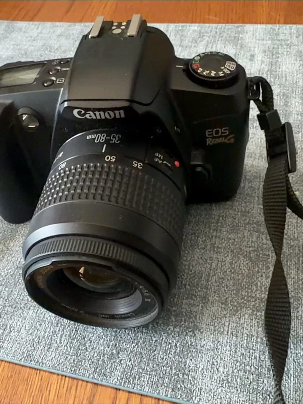 WORKING Canon DSLR Film Camera with Black Body and Blue-Red EOS Strap